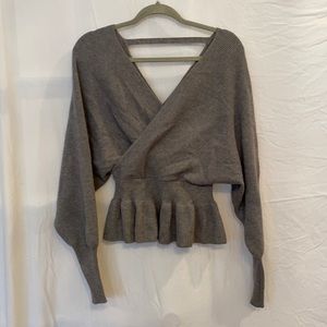 Grey knit peplum sweater with bell sleeves & cross cross front and back
